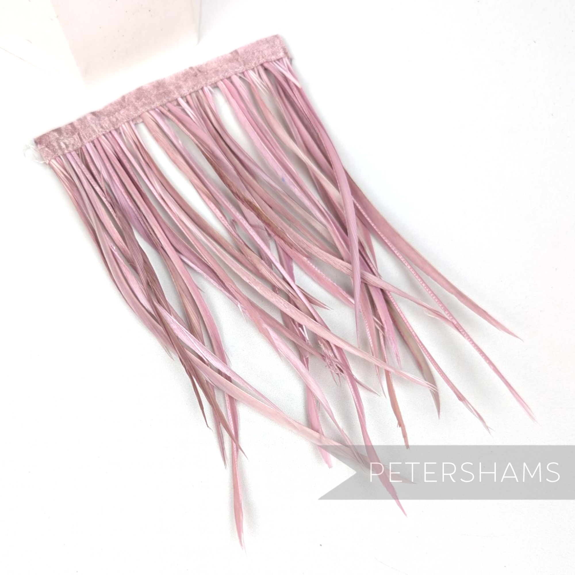 Petershams Millinery Supplies extra long dusky pink goose biot feather fringe on a satin ribbon binding