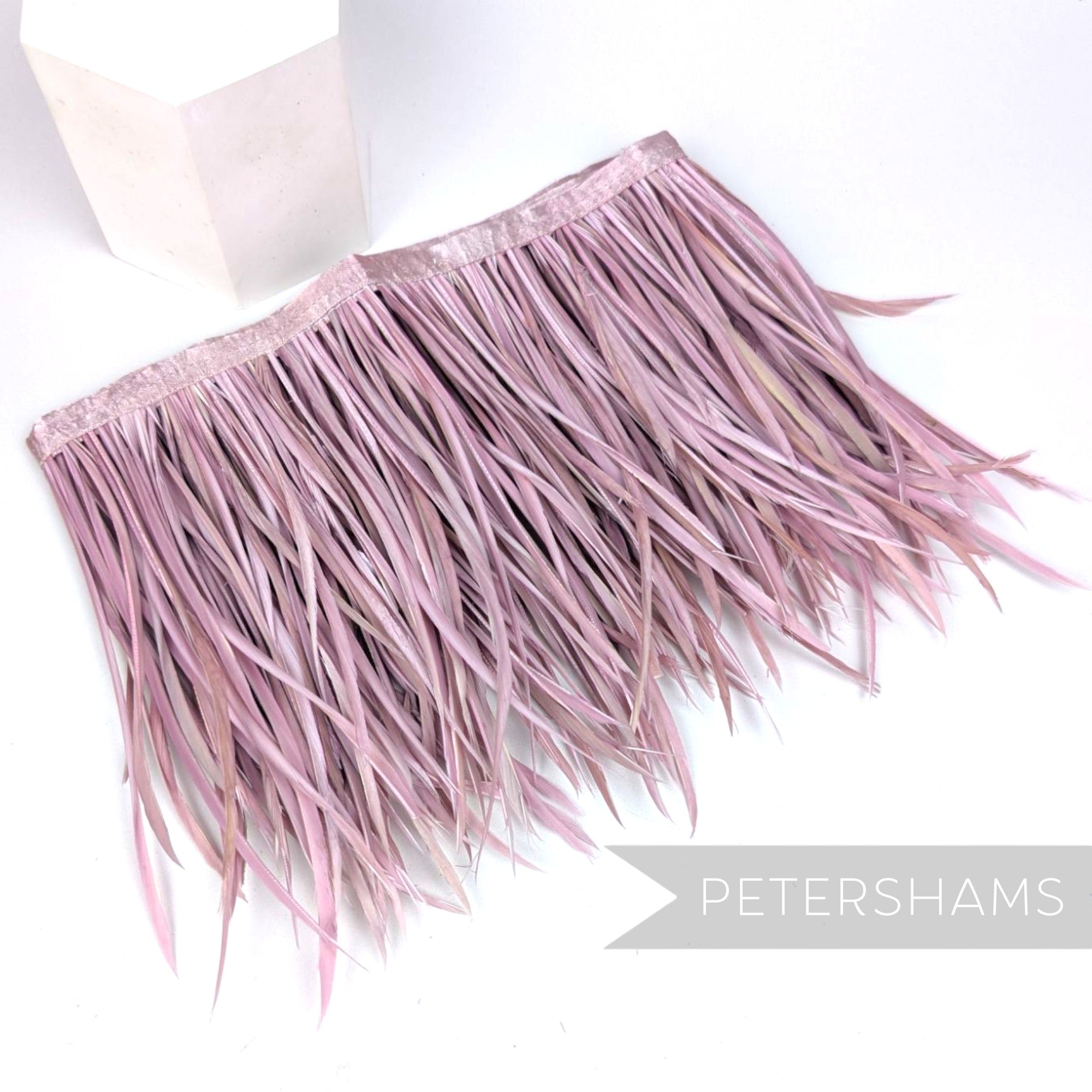 Petershams Millinery Supplies extra long dusky pink goose biot feather fringe on a satin ribbon binding