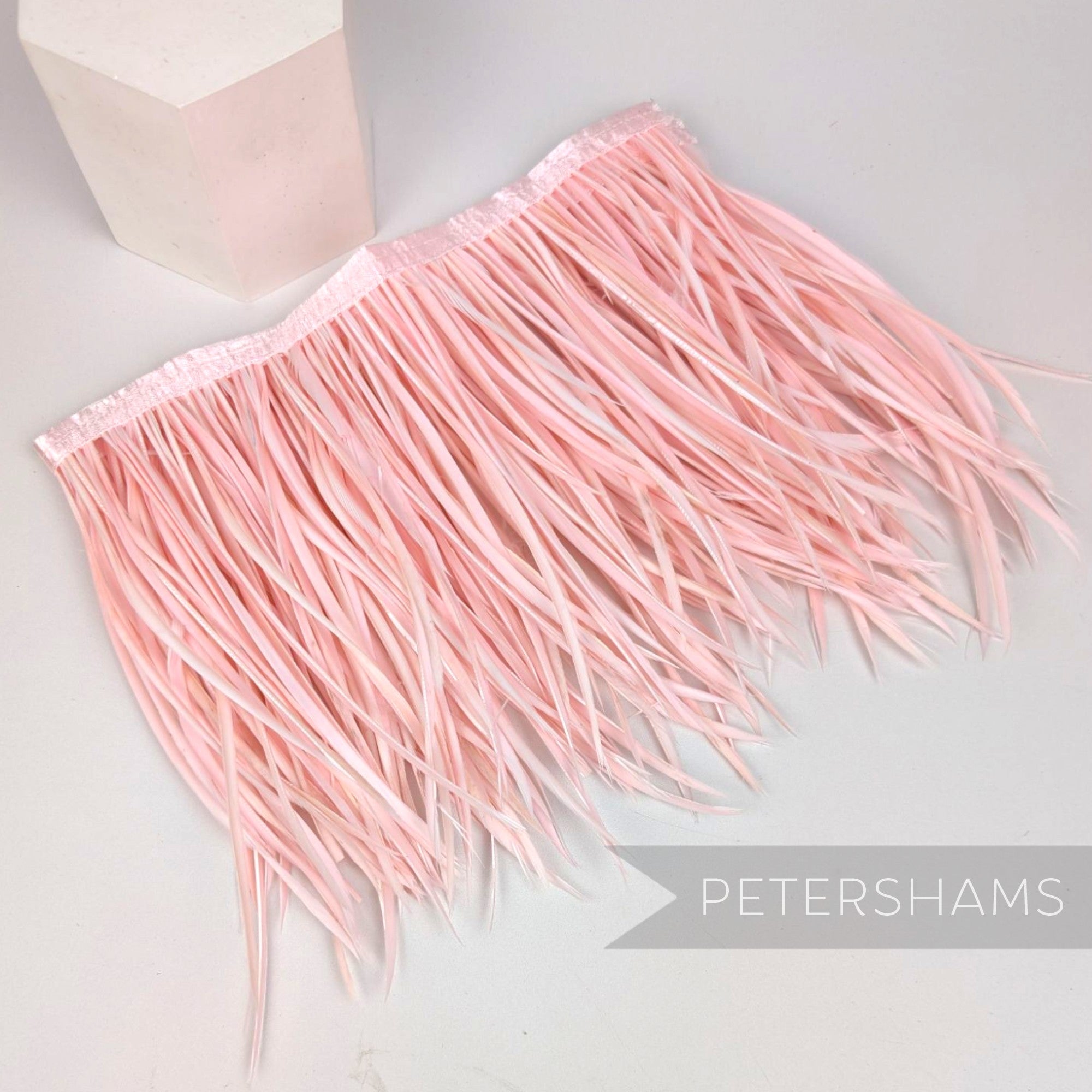 Petershams Millinery Supplies extra long pale pink goose biot feather fringe on a stitched satin ribbon binding