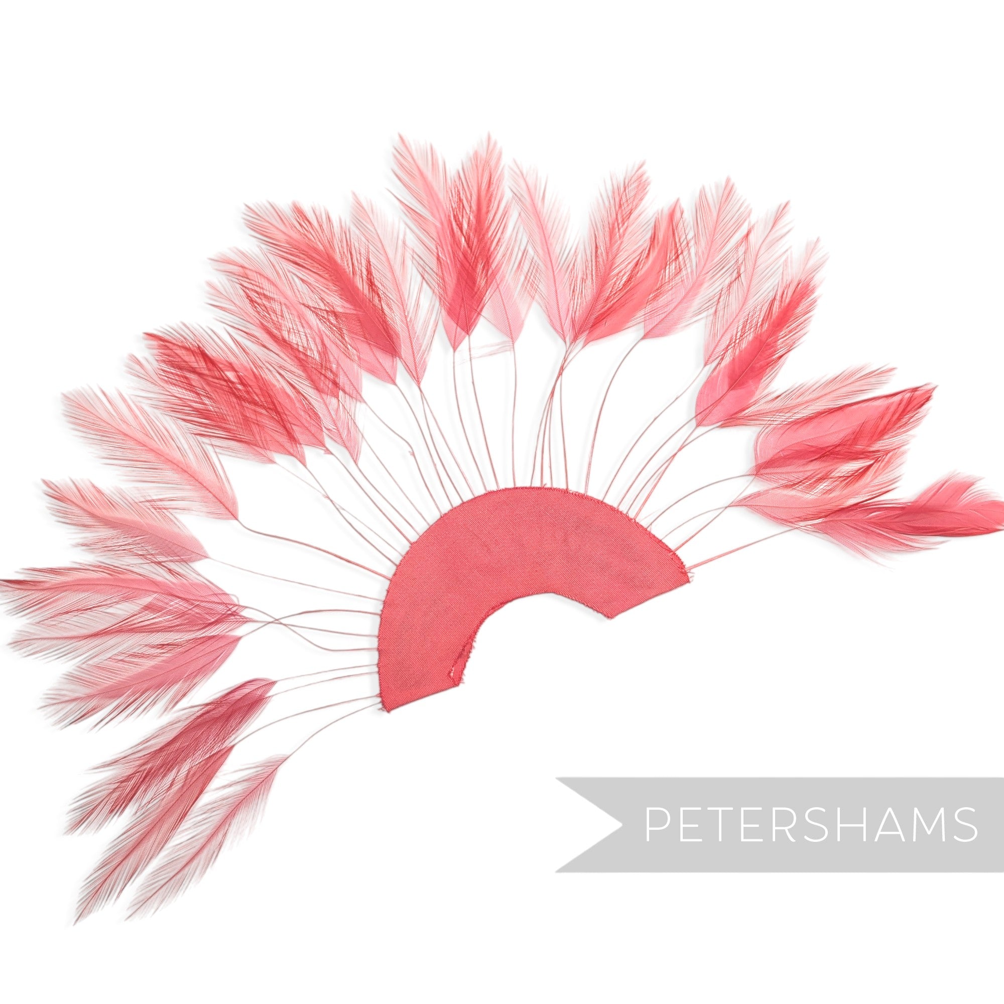 Petershams Millinery Supplies coral stripped hackle feather fan on a cotton base for hat and fascinator trimming.