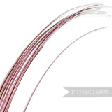 Petershams Millinery Supplies long stripped ostrich quill feather in a soft metallic pink for hat making and crafts.