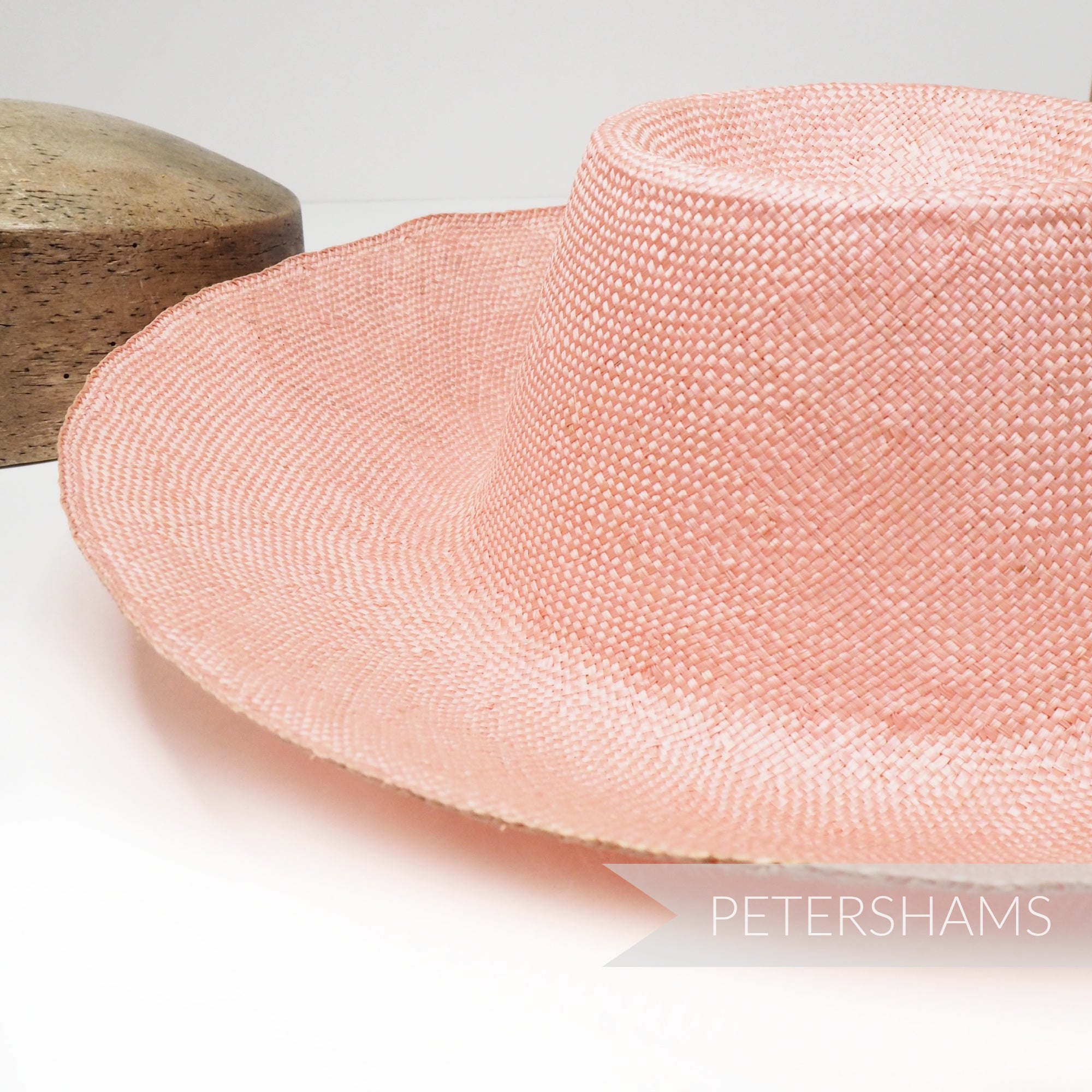 Petershams Millinery Supplies peachy pink ramie straw capeline hat body with a 1x1 checker weave and smooth ironed finish.