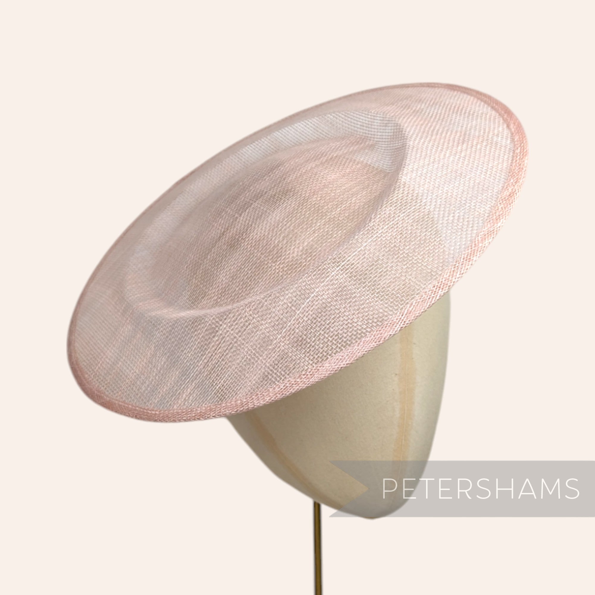 Petershams Millinery Supplies 29cm round rose pink sinamay saucer fascinator base on a millinery head form