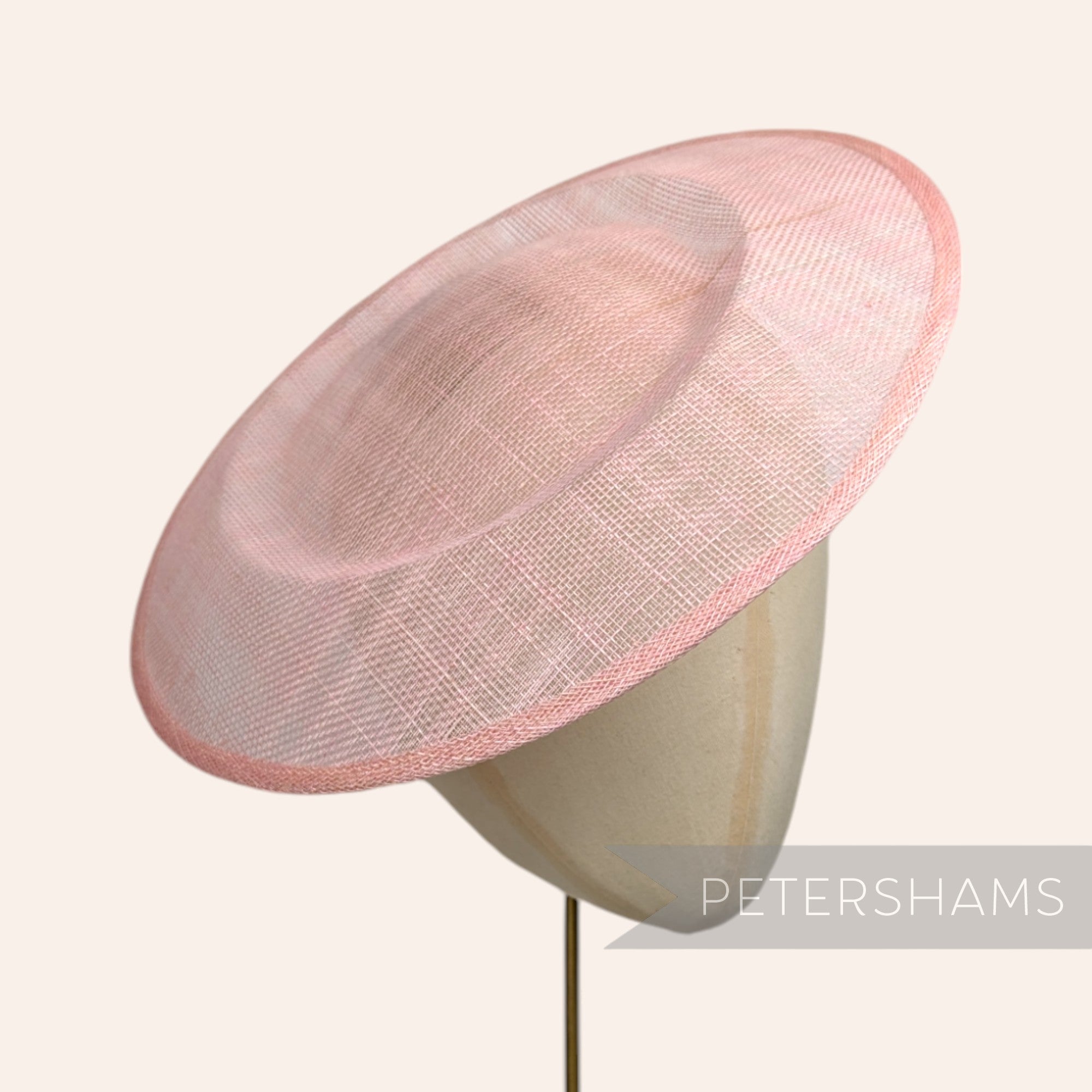 Petershams Millinery Supplies large pink round sinamay fascinator hat base on a mannequin head