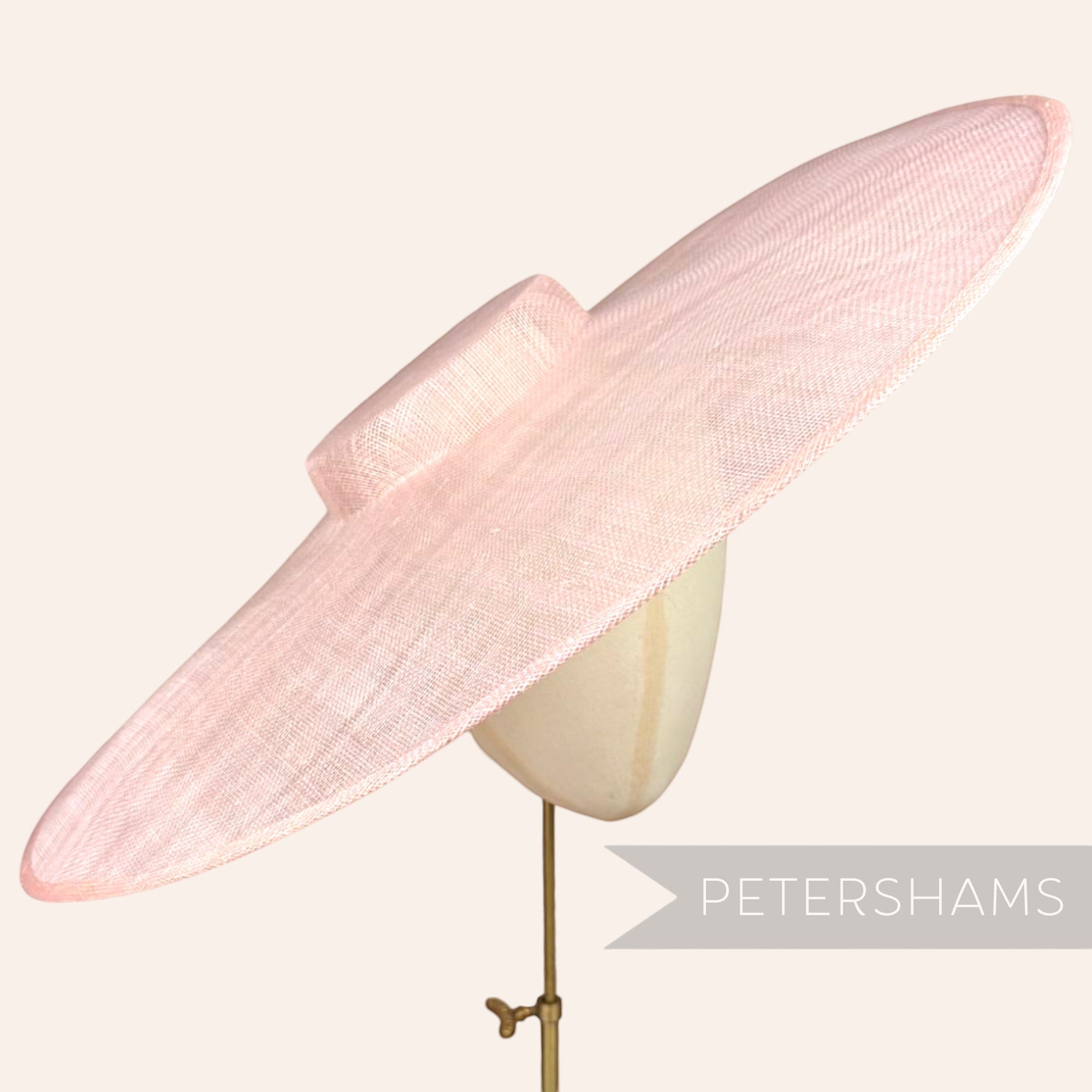Petershams Millinery Supplies extreme pale pink sinamay cartwheel fascinator hat base on a mannequin head