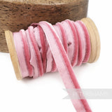 Petershams Millinery Supplies 5mm pink velvet insertion piping cord on a wooden spool for millinery and sewing.