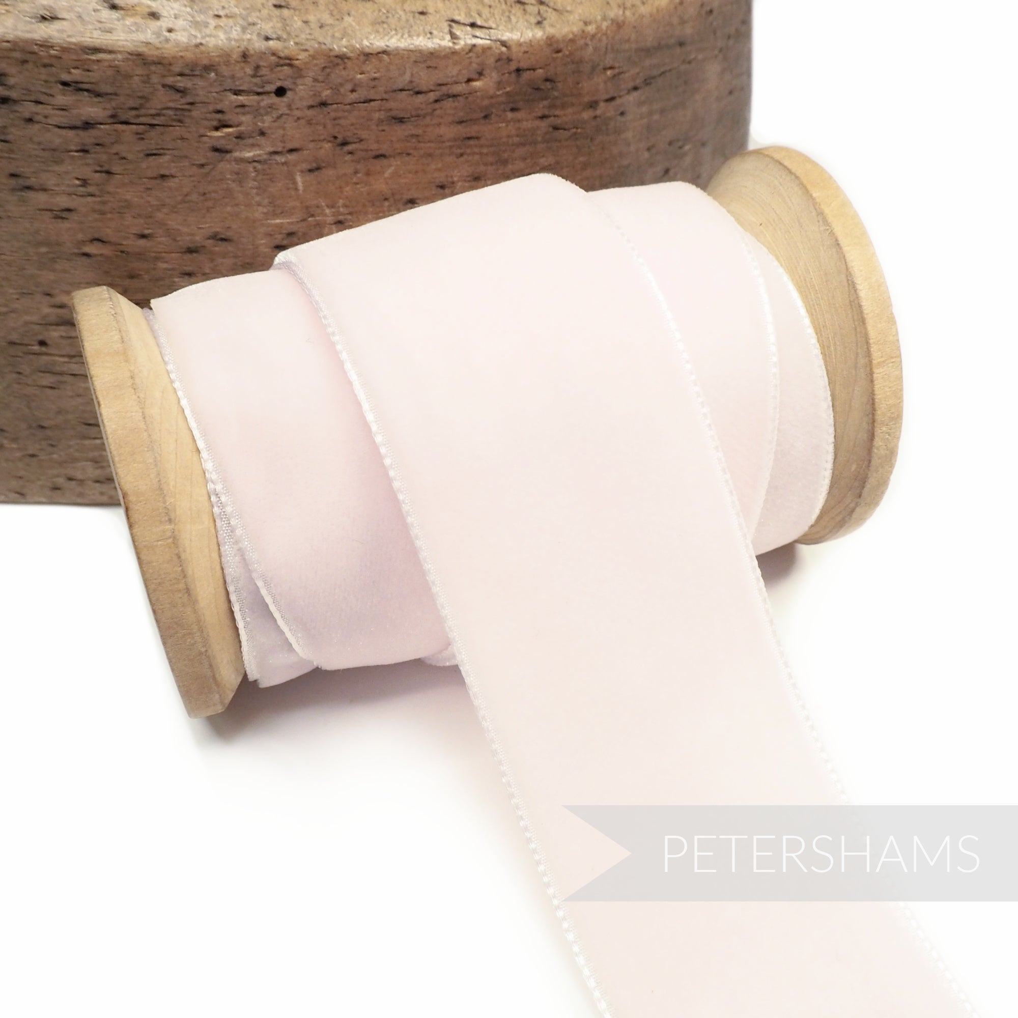 Petershams Millinery Supplies 36mm pale pink French velvet ribbon on a wooden spool for millinery and craft projects.