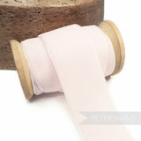 Petershams Millinery Supplies 36mm pale pink French velvet ribbon on a wooden spool for millinery and craft projects.