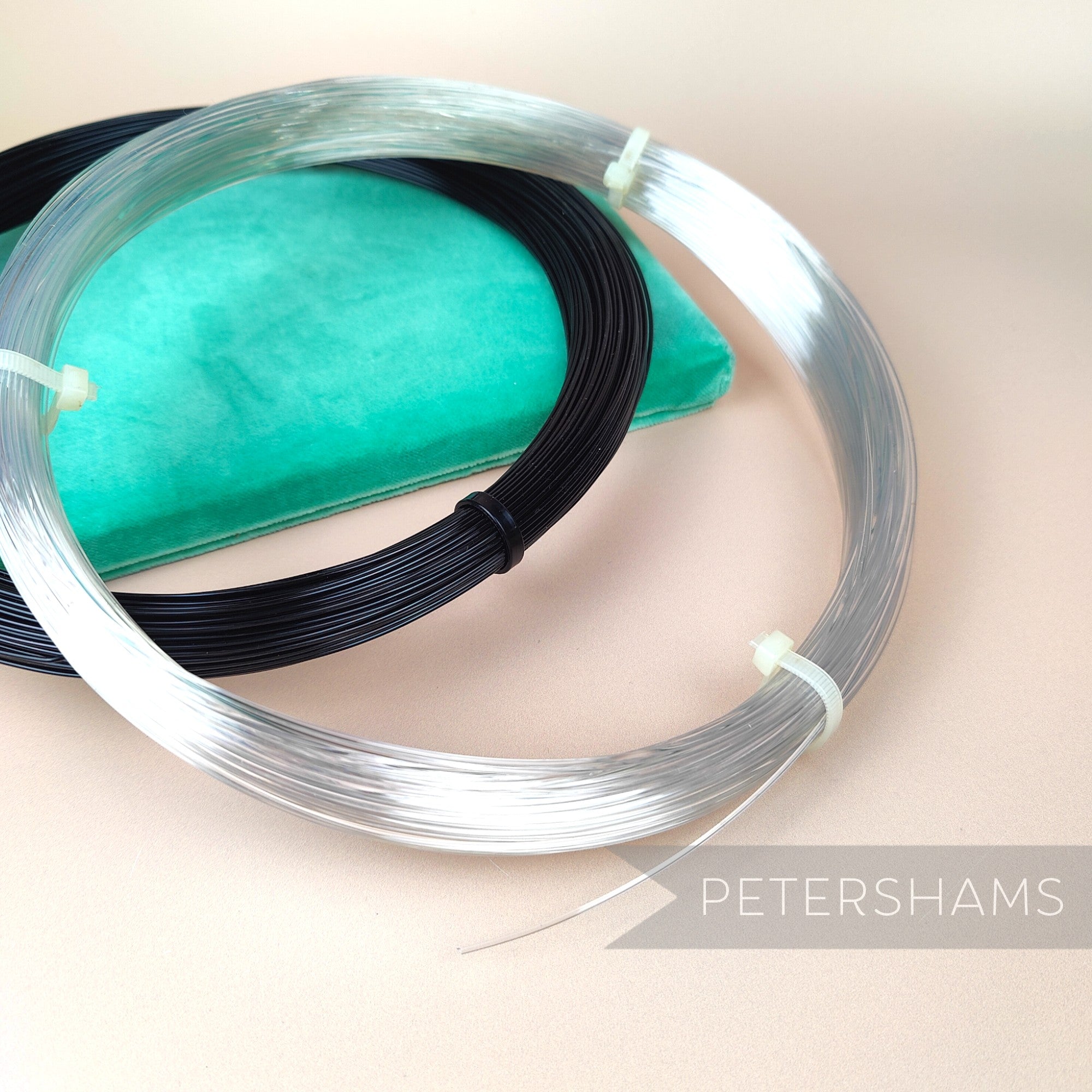 Petershams Millinery Supplies 1.2mm plastic hat brim wire in clear and black coils for millinery structure