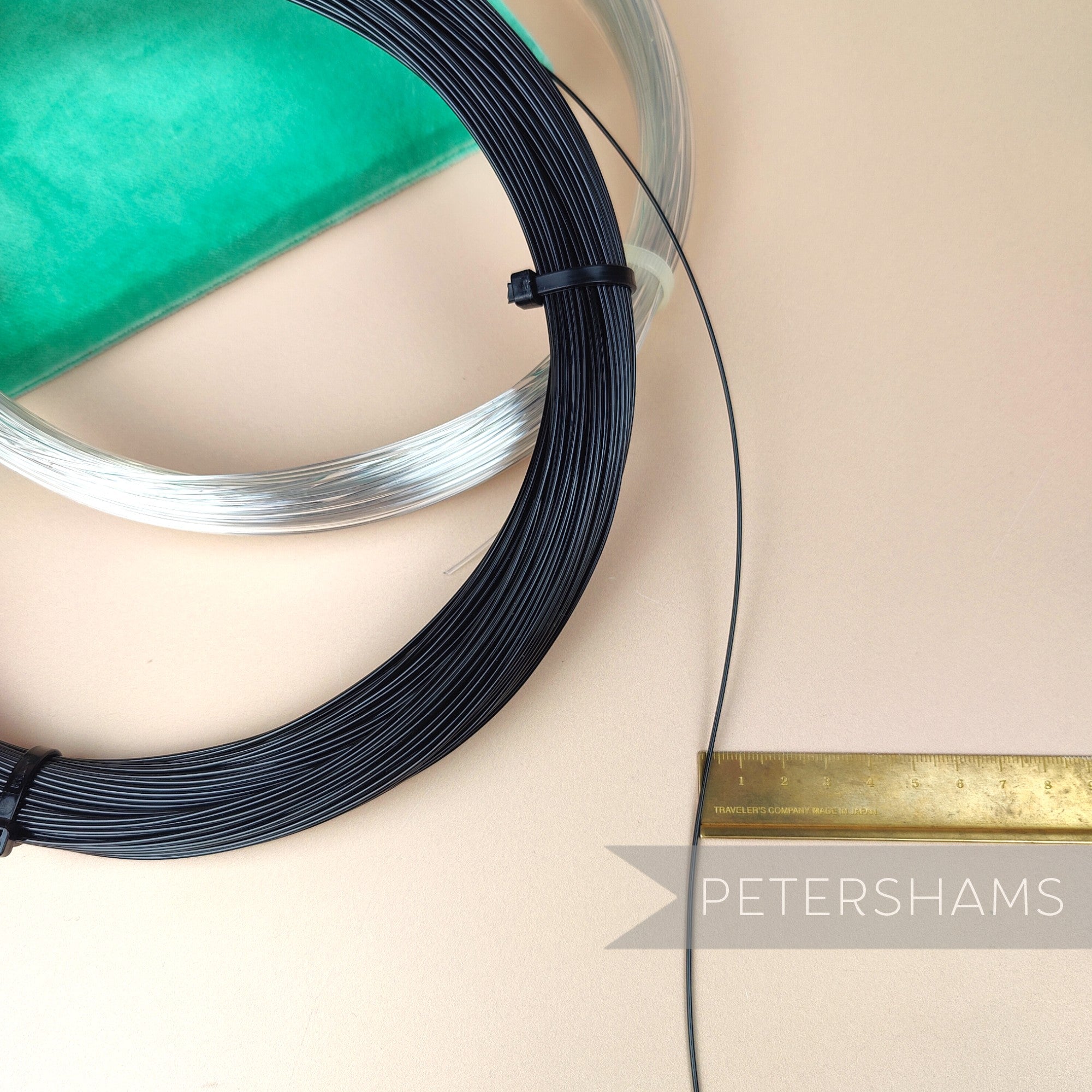 Petershams Millinery Supplies 1.2mm plastic hat brim wire in black and clear coils