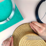 Petershams Millinery Supplies 1.2mm plastic hat brim wire in clear and black being applied to a straw hat