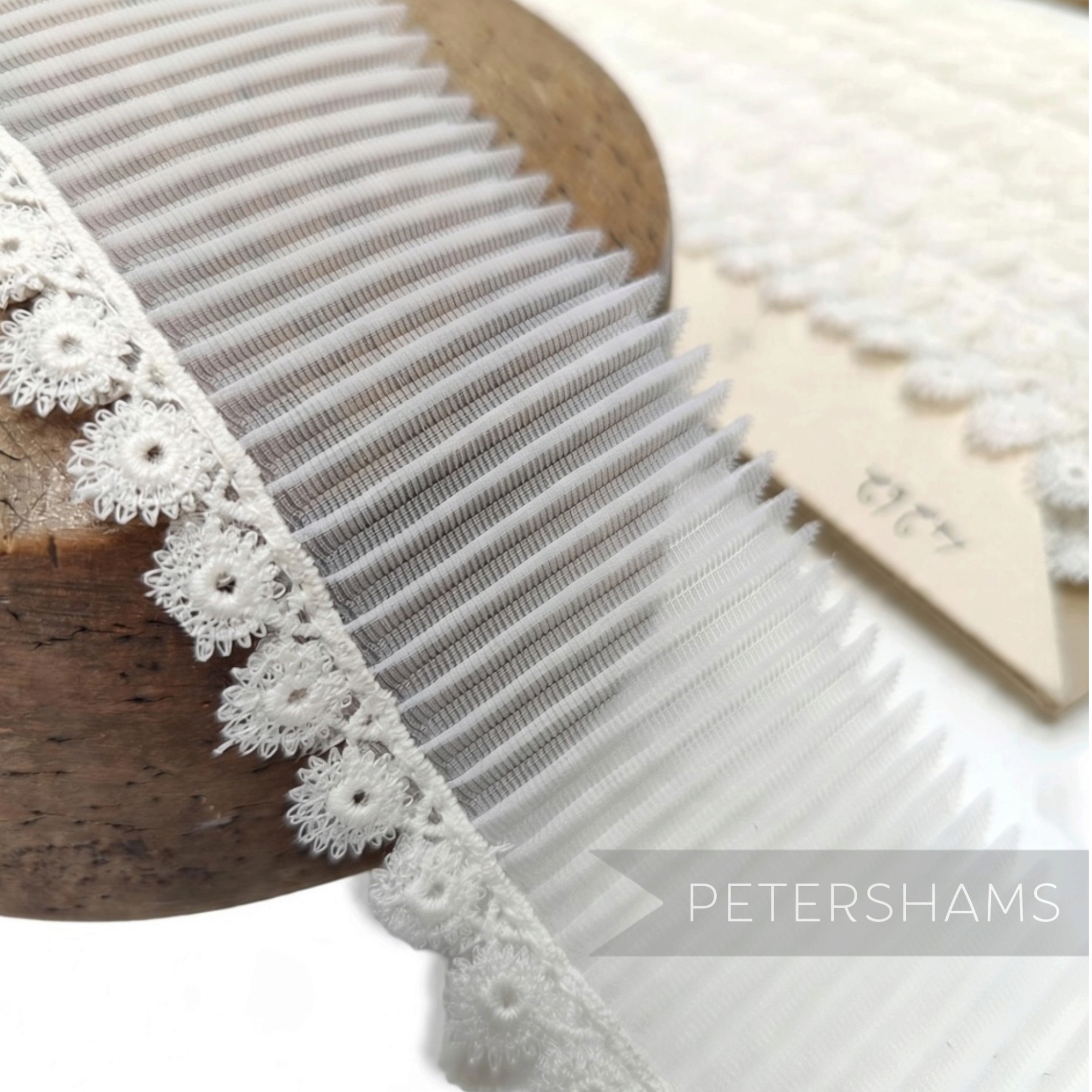 Petershams Millinery Supplies vintage 1950s white pleated synthetic trim with circular guipure lace edge
