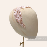 Petershams Millinery Supplies Polly floral lace motif in blush pink with beads and sequins on a millinery head block.