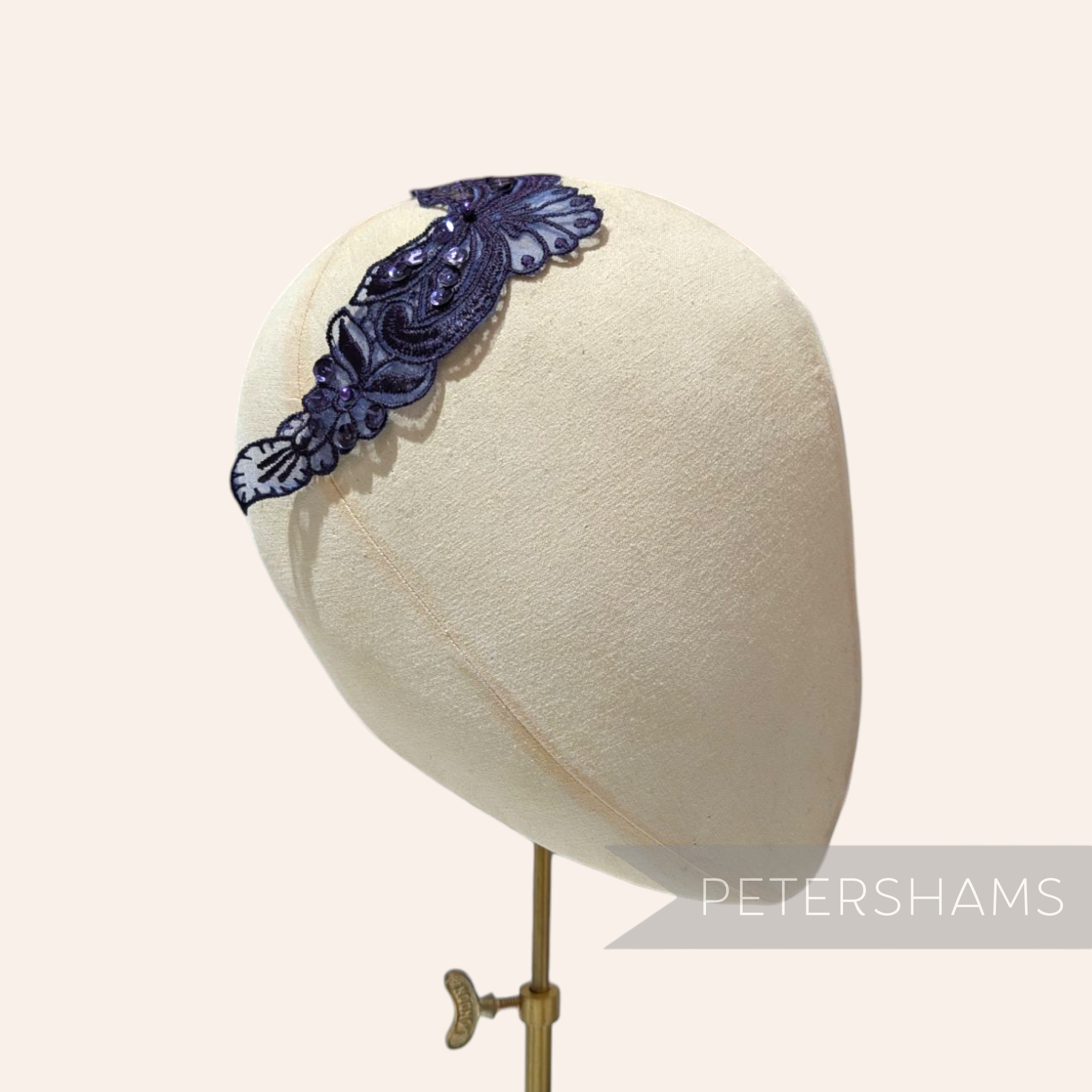 Petershams Millinery Supplies Polly navy blue floral lace motif with beads and sequins on a millinery head form