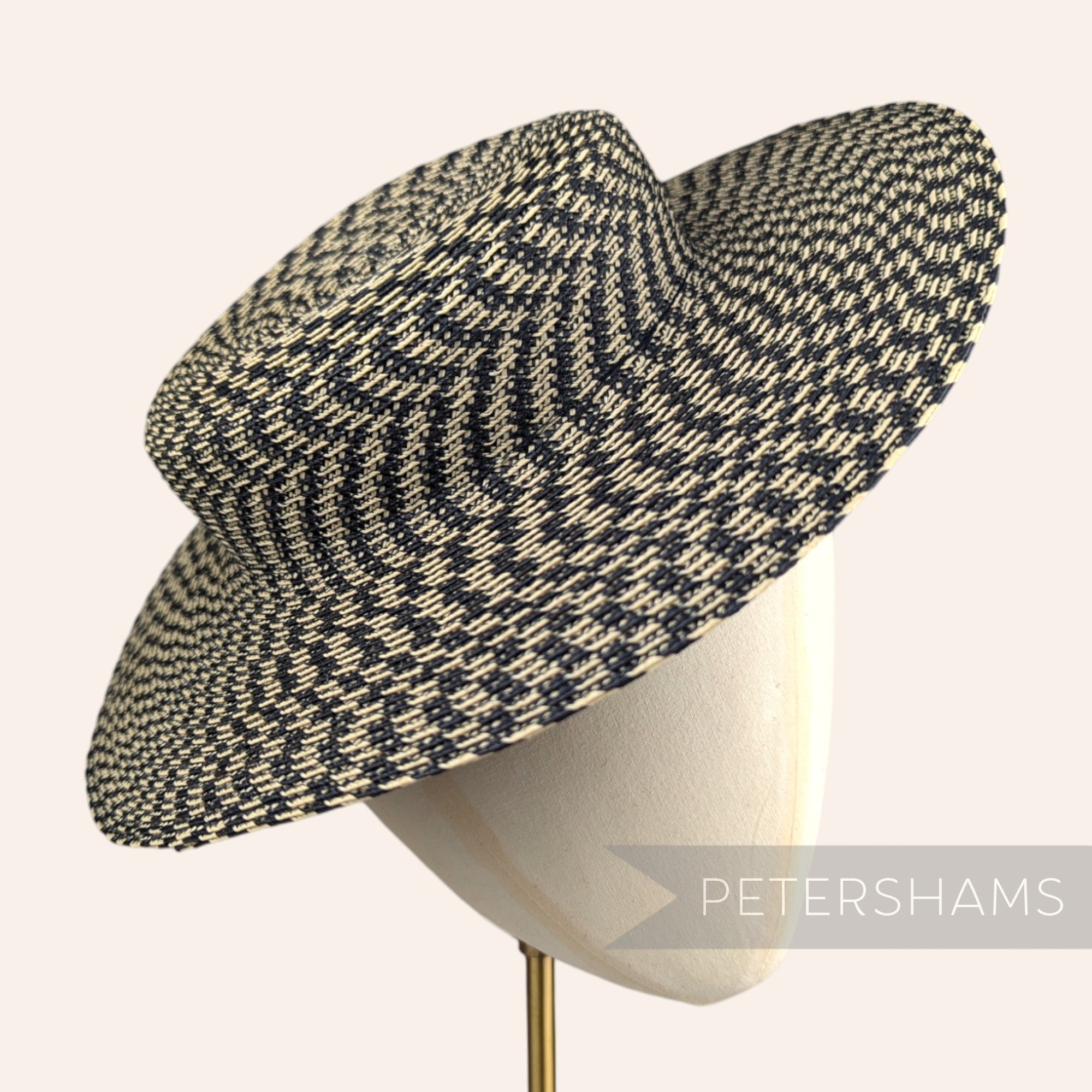 Petershams Millinery Supplies small brim boater fascinator hat base in a black and straw spiralled polybraid weave.