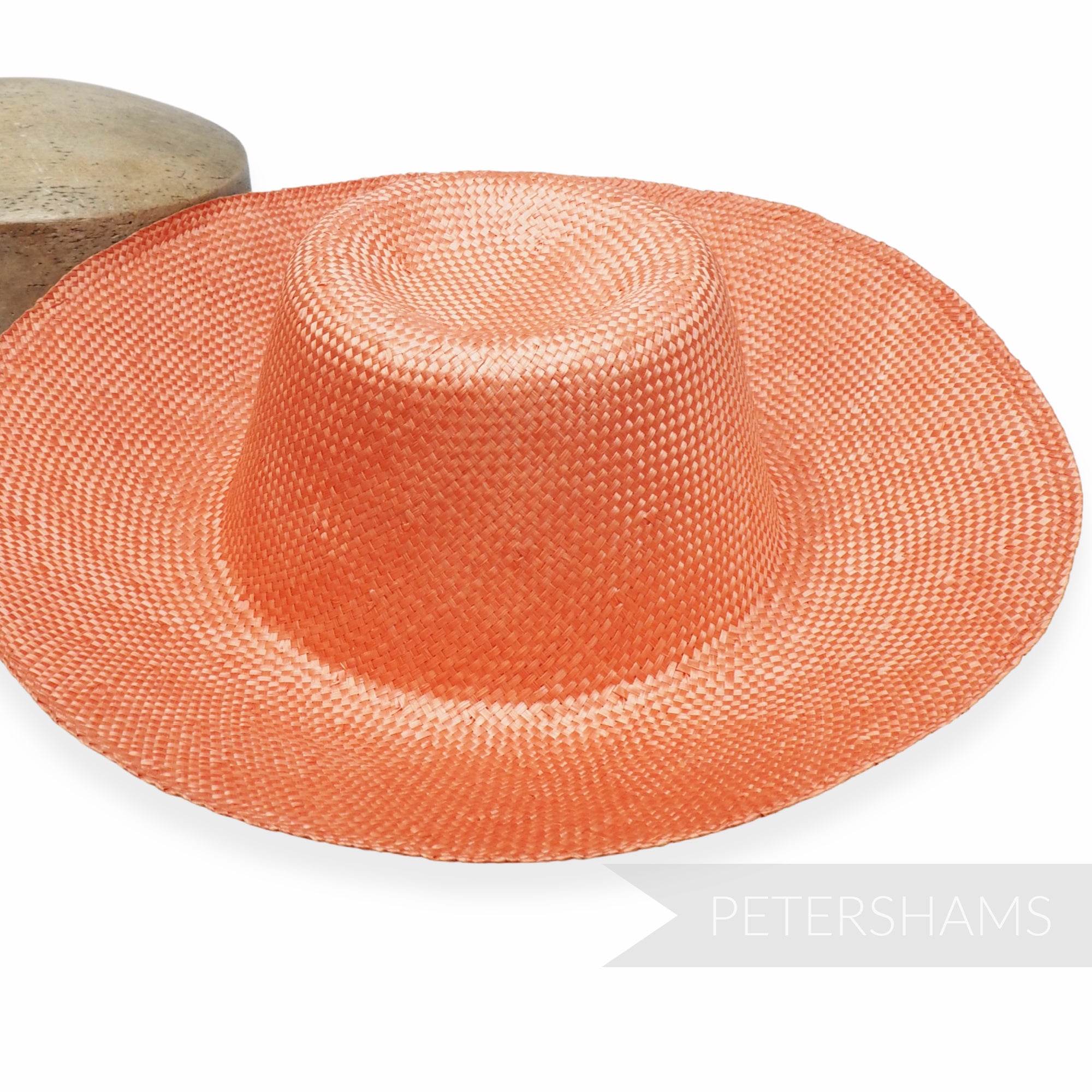 Petershams Millinery Supplies pumpkin ramie straw capeline hat body with a 1x1 checker weave pattern.