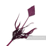 Petershams Millinery Supplies bright plum turkey quill feather cut into an arrowhead shape with decorative barbs.