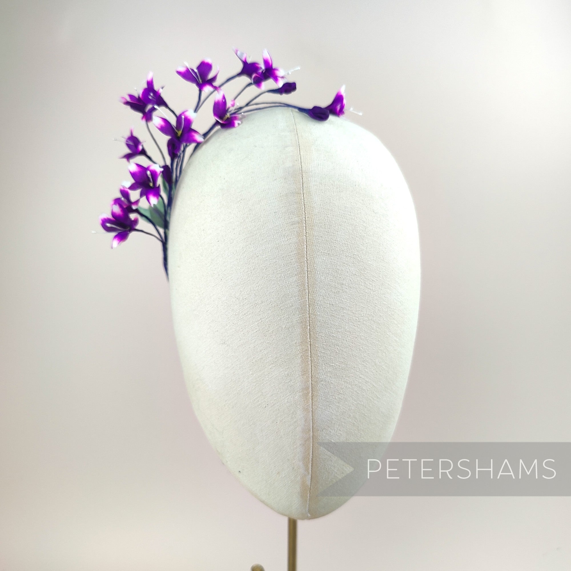 Petershams Millinery Supplies vintage 1980s purple blossom spray on a millinery head form