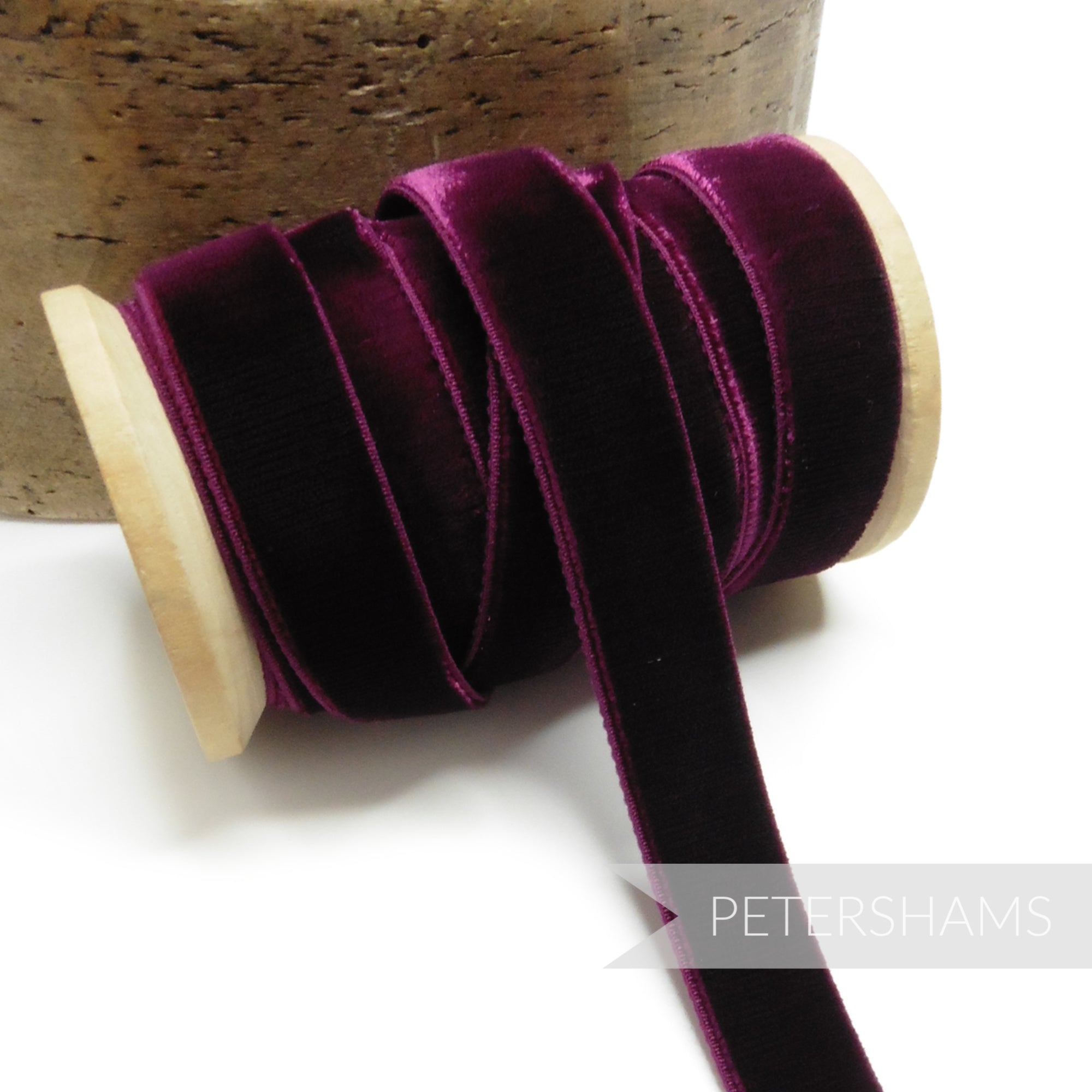 Petershams Millinery Supplies 16mm deep purple elastic stretch velvet ribbon on a wooden spool
