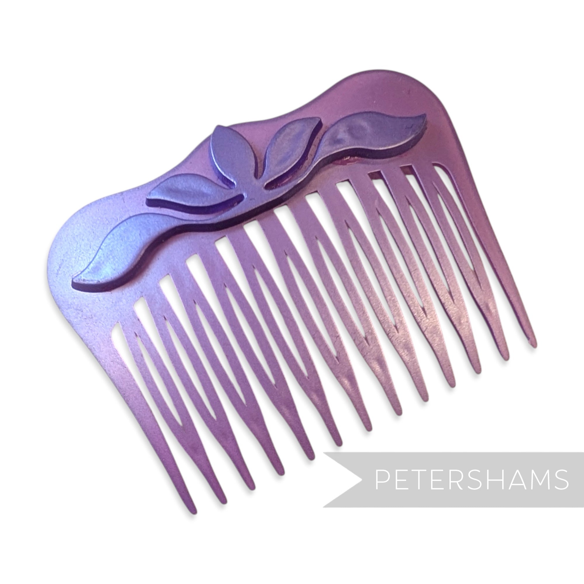 Petershams Millinery Supplies vintage 1970s purple pearlised plastic hair comb with raised floral relief motif