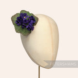 Petershams Millinery Supplies purple faux silk hydrangea flower mount with green leaves on a millinery head block
