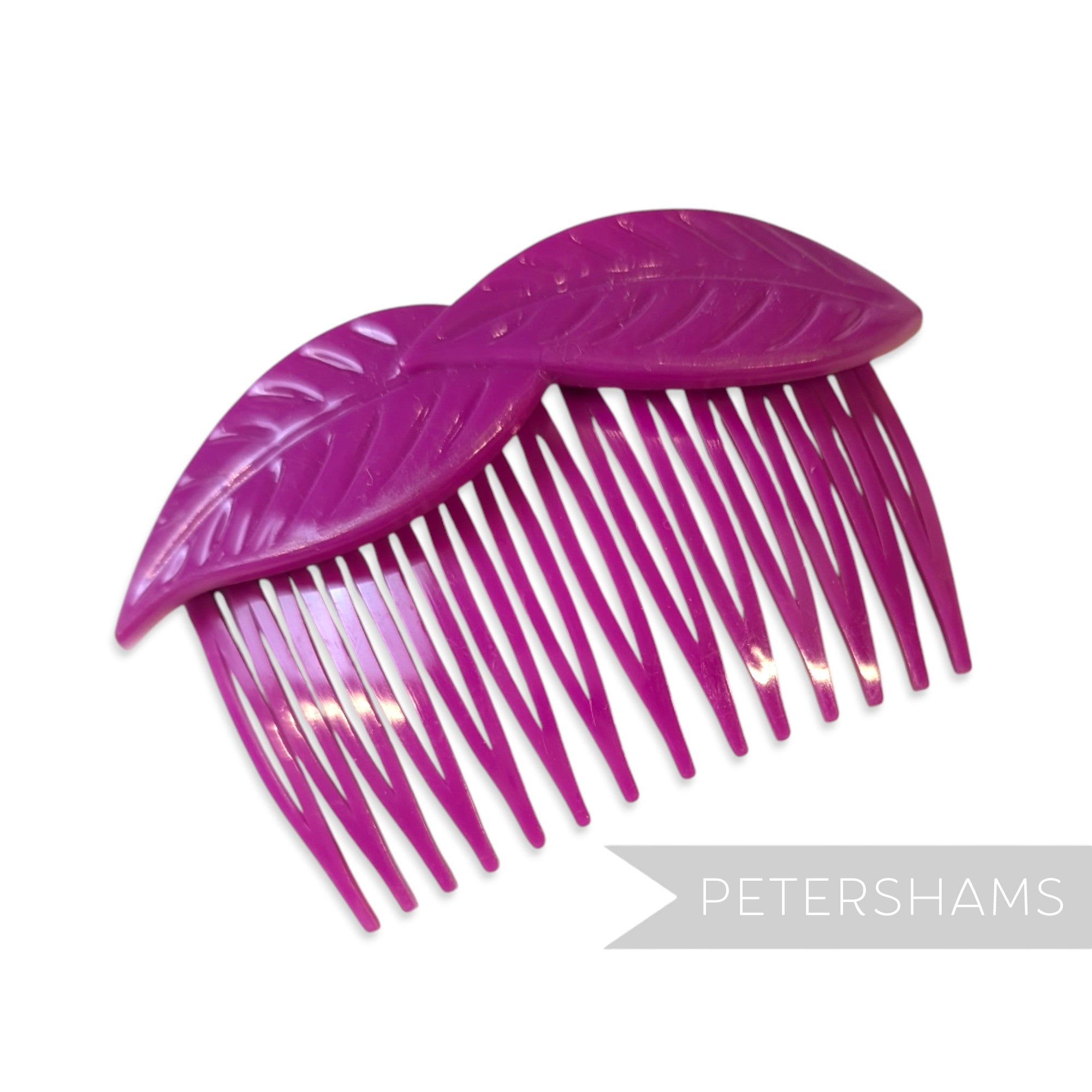 Petershams Millinery Supplies vintage 1980s purple plastic hair comb with a layered leaf design