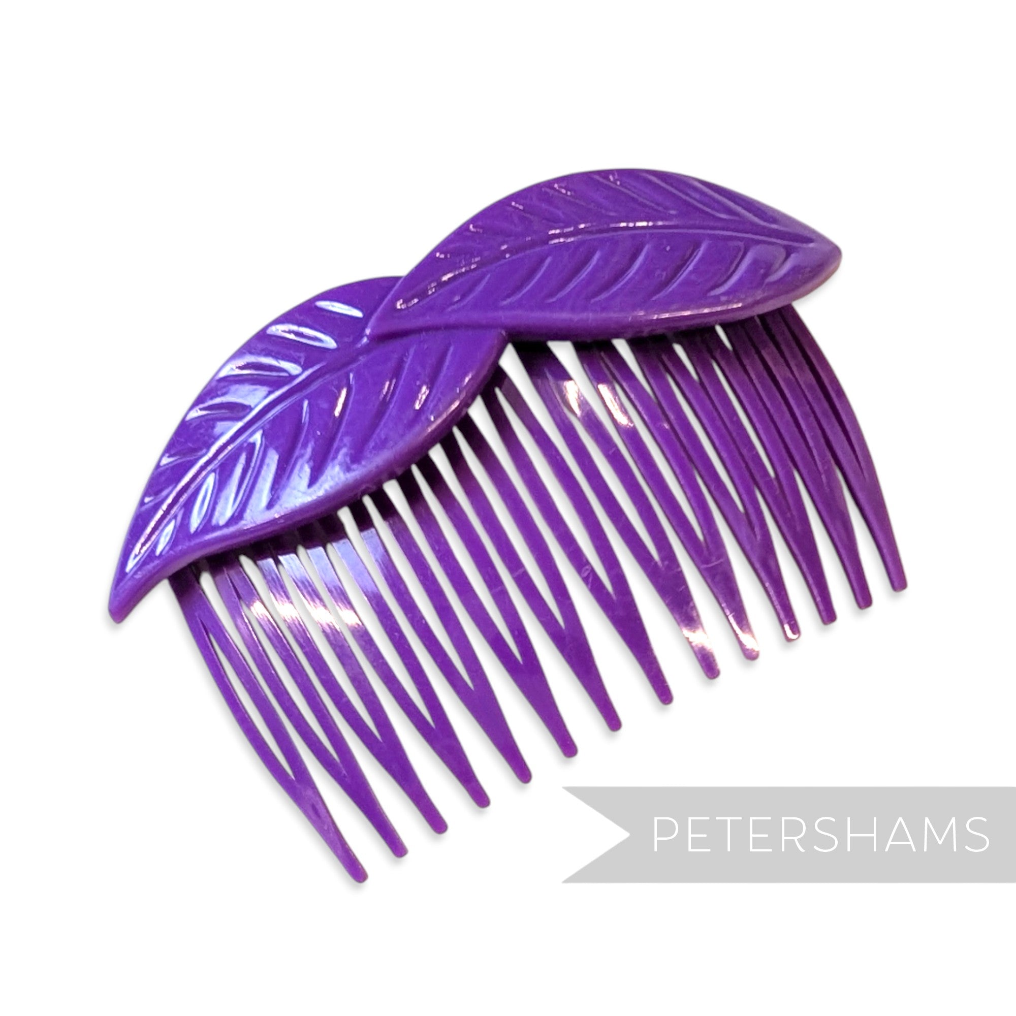 Petershams Millinery Supplies vintage 1980s purple plastic hair comb with a layered leaf design