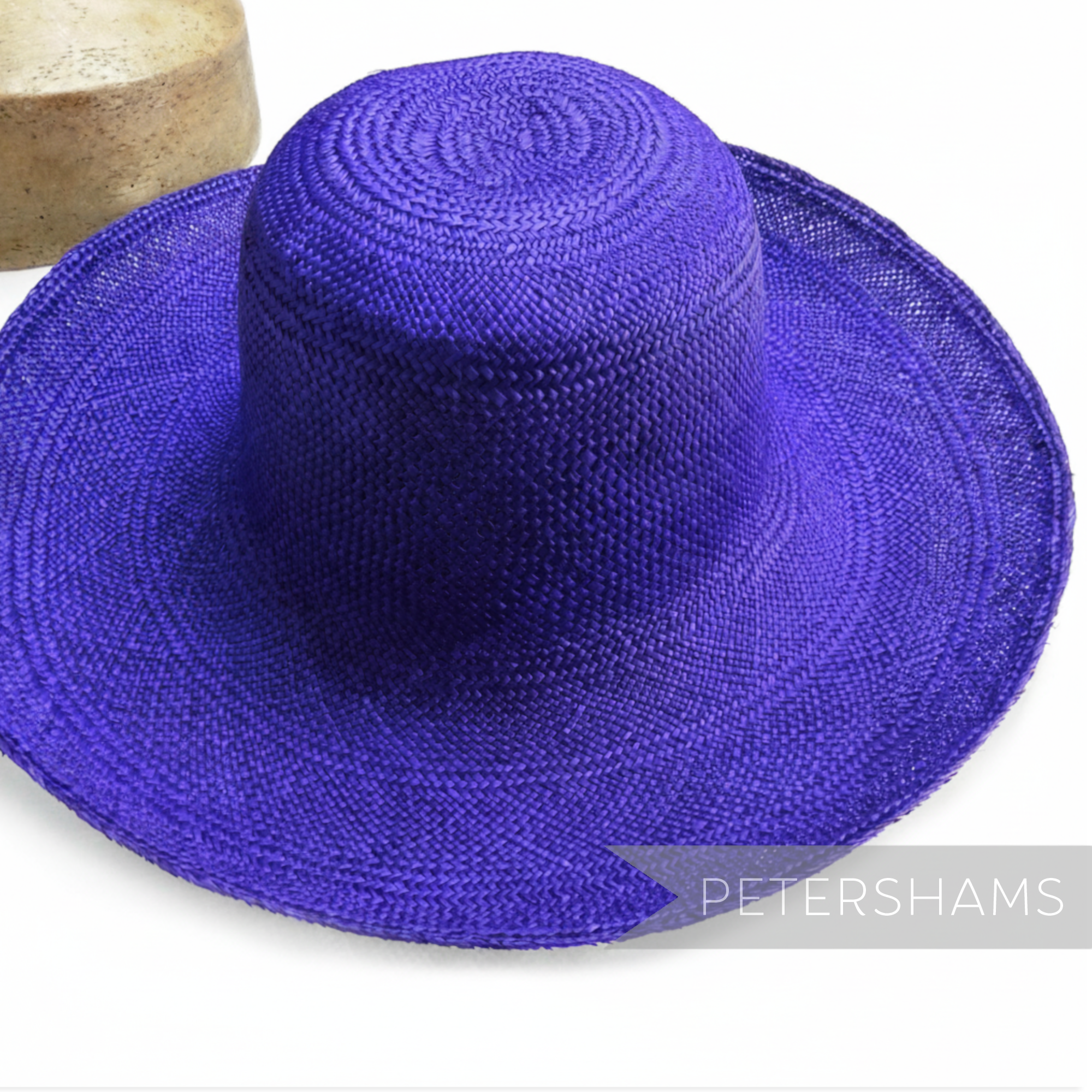 Petershams Millinery Supplies royal purple handmade Panama straw capeline hat body with fine circular weave.