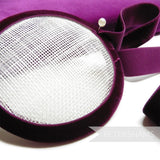 Petershams Millinery Supplies 23mm deep purple elastic velvet ribbon wrapped around a white sinamay fascinator base.
