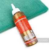 Petershams Millinery Supplies PVA adhesive bottle for stiffening straw hats, shown on a green velvet surface