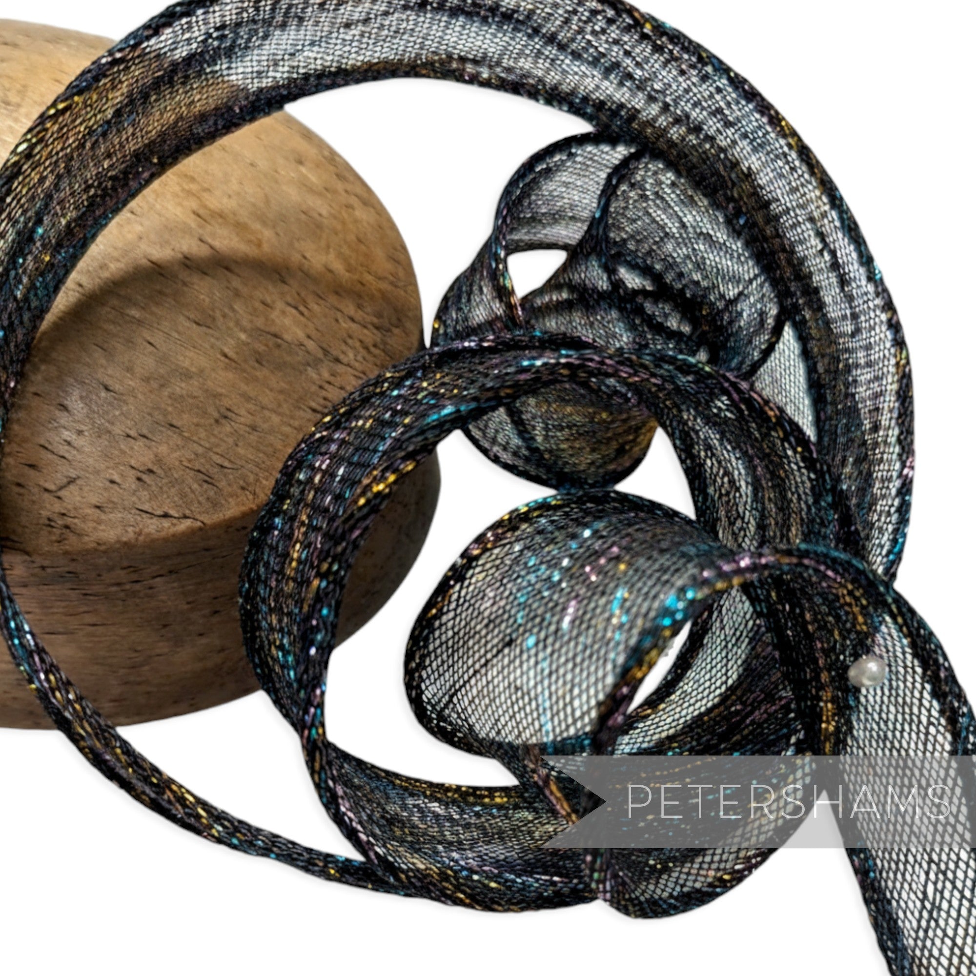 Petershams Millinery Supplies black lurex sinamay ribbon with rainbow metallic threads and hand-rolled edges.