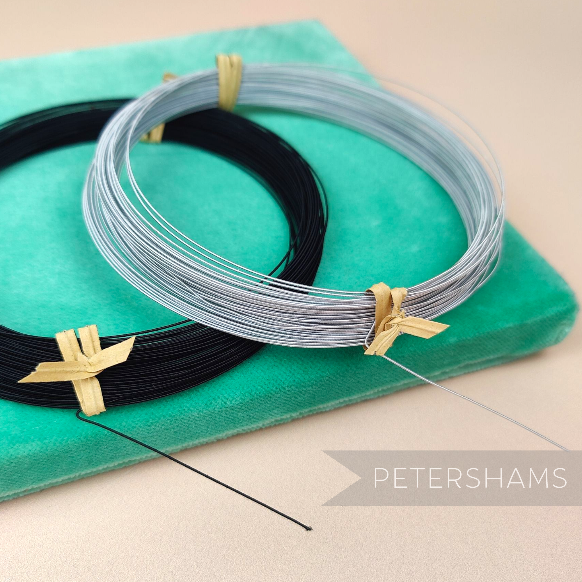 Petershams Millinery Supplies 0.4mm French rayon covered millinery wire in black and silver coils