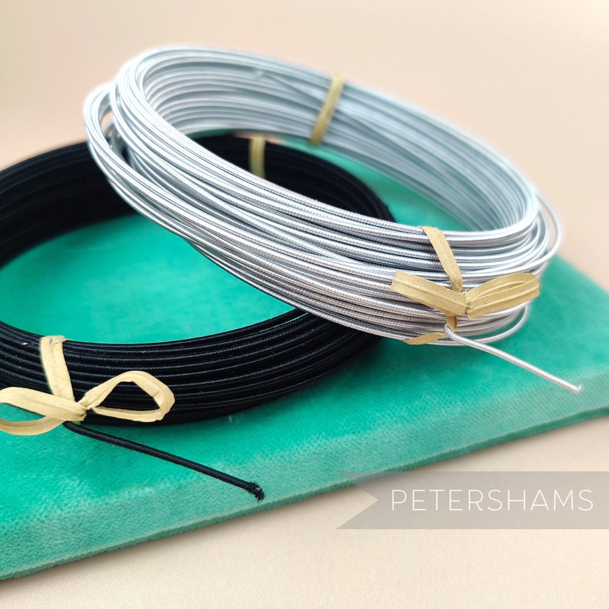Petershams Millinery Supplies 1.2mm French rayon covered millinery wire in black and silver coils