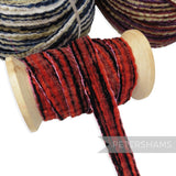 Petershams Millinery Supplies 15mm red and black chenille threaded crin braid on a wooden spool
