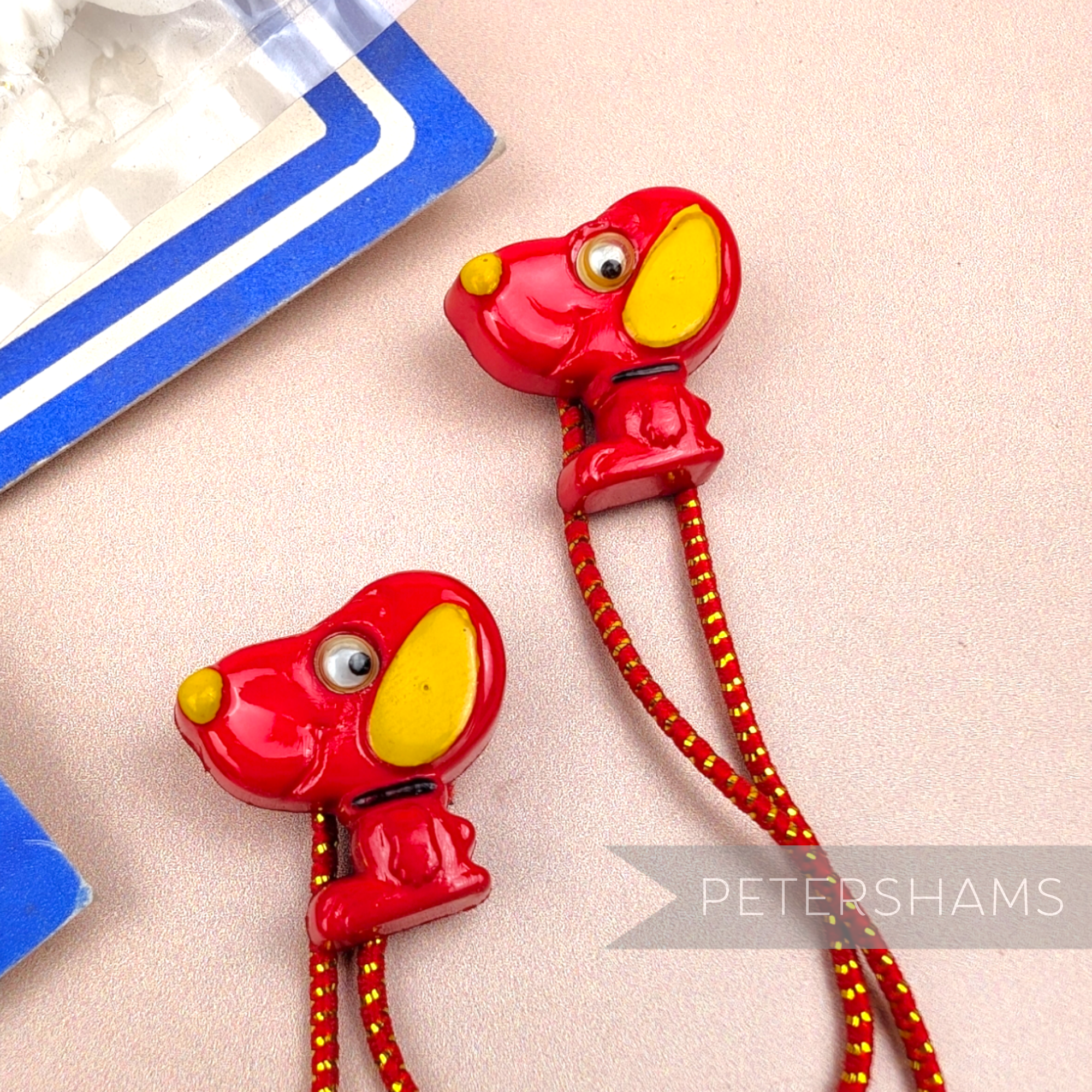 Petershams Millinery Supplies vintage red cartoon dog hair bobbles with yellow ears and elastic hair ties