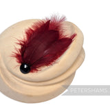 Petershams Millinery Supplies deep red marabou and coque feather hat mount with a black faceted bead accent.