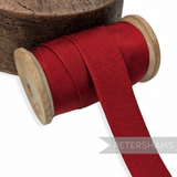 Petershams Millinery Supplies vintage 25mm wide deep red grosgrain ribbon on a wooden spool for hat making.