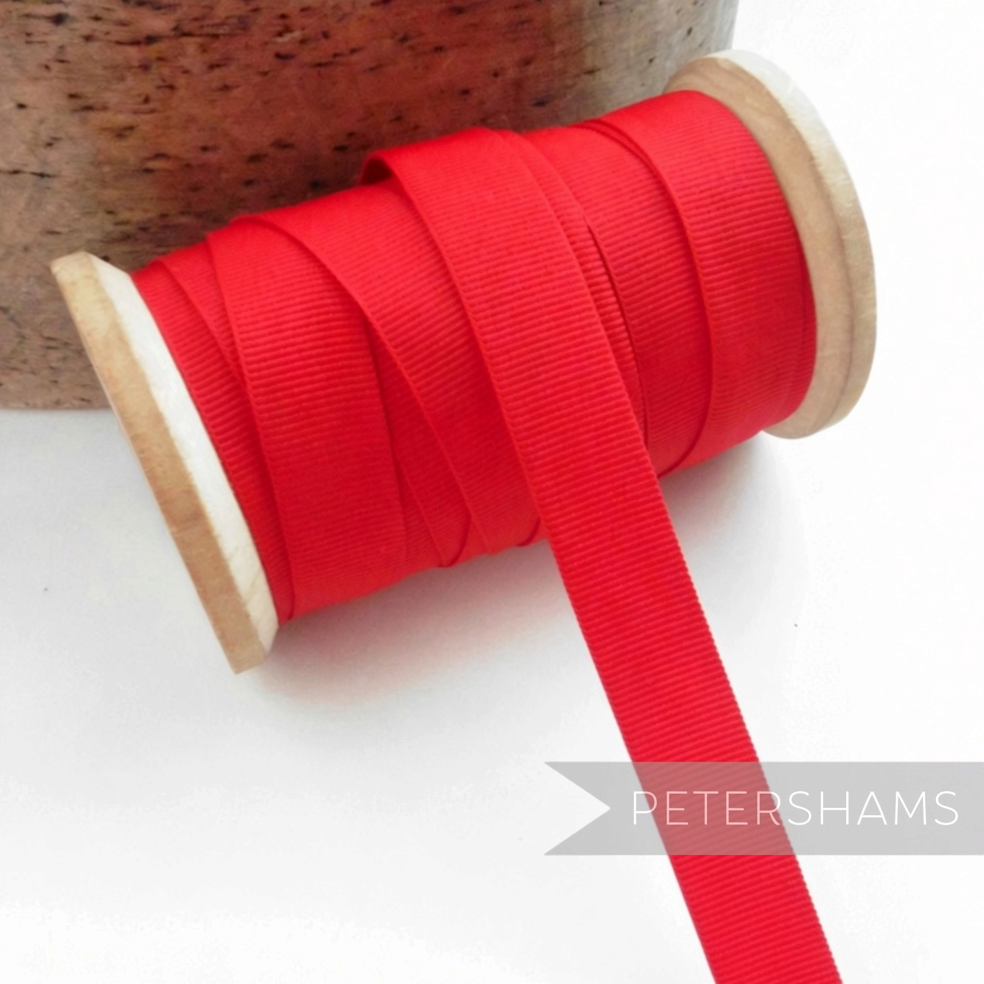 Petershams Millinery Supplies 15mm wide vintage red grosgrain ribbon on a wooden spool for hat trimming