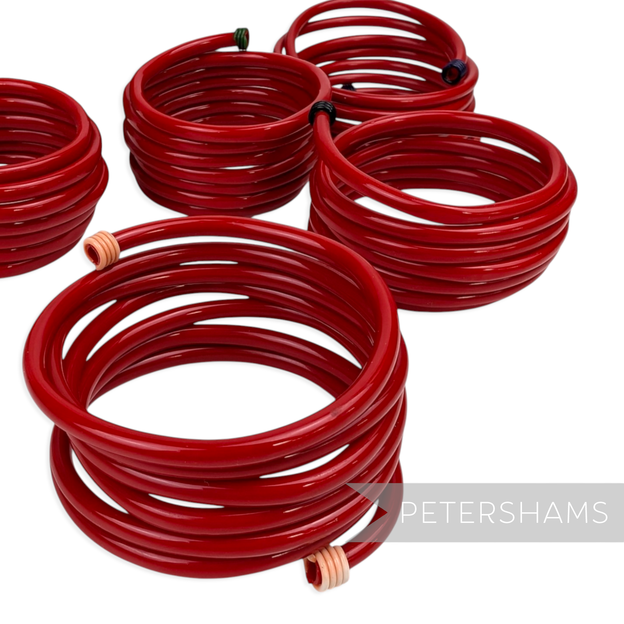 Petershams Millinery Supplies vintage red plastic tube wrap bracelets with multi-coloured end caps for small wrists.