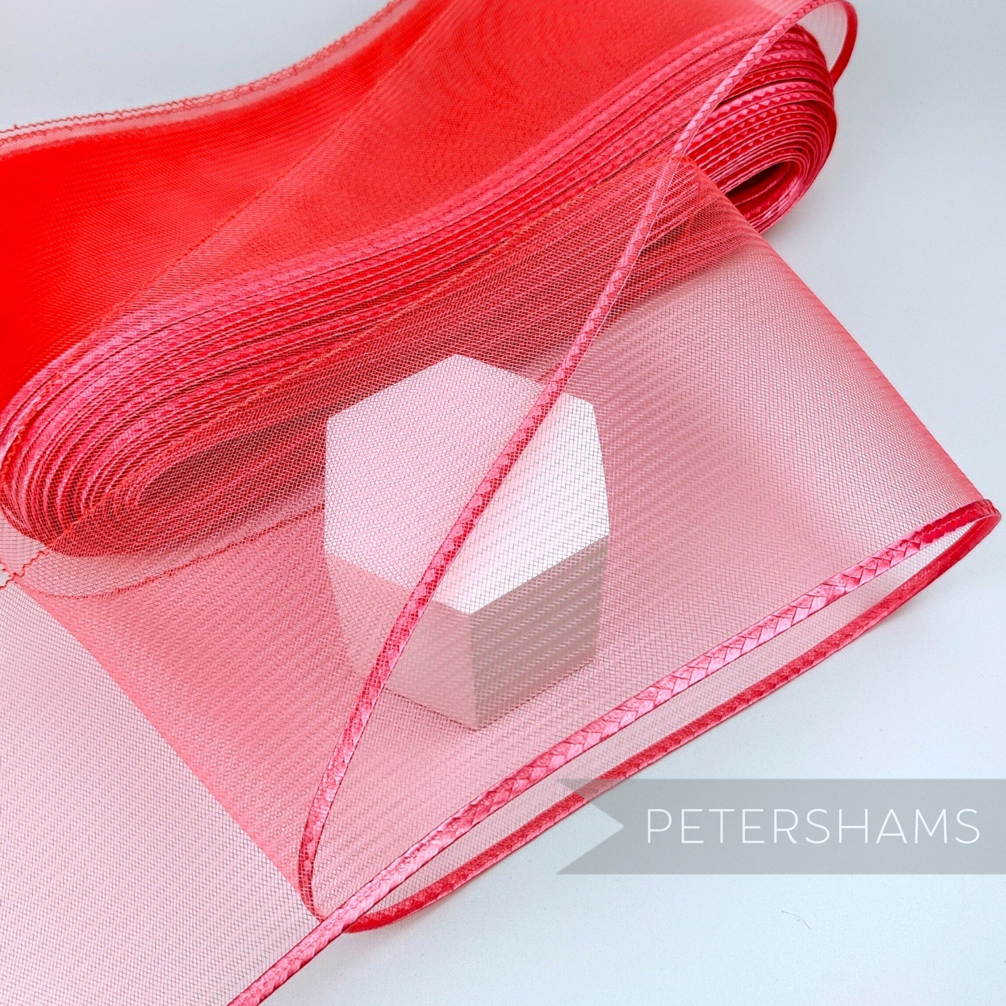 Petershams Millinery Supplies red 15cm wide crinoline ribbon with a shiny polybraid edge for millinery and crafts.