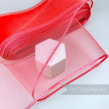 Petershams Millinery Supplies red 15cm wide crinoline ribbon with a shiny polybraid edge for millinery and crafts.