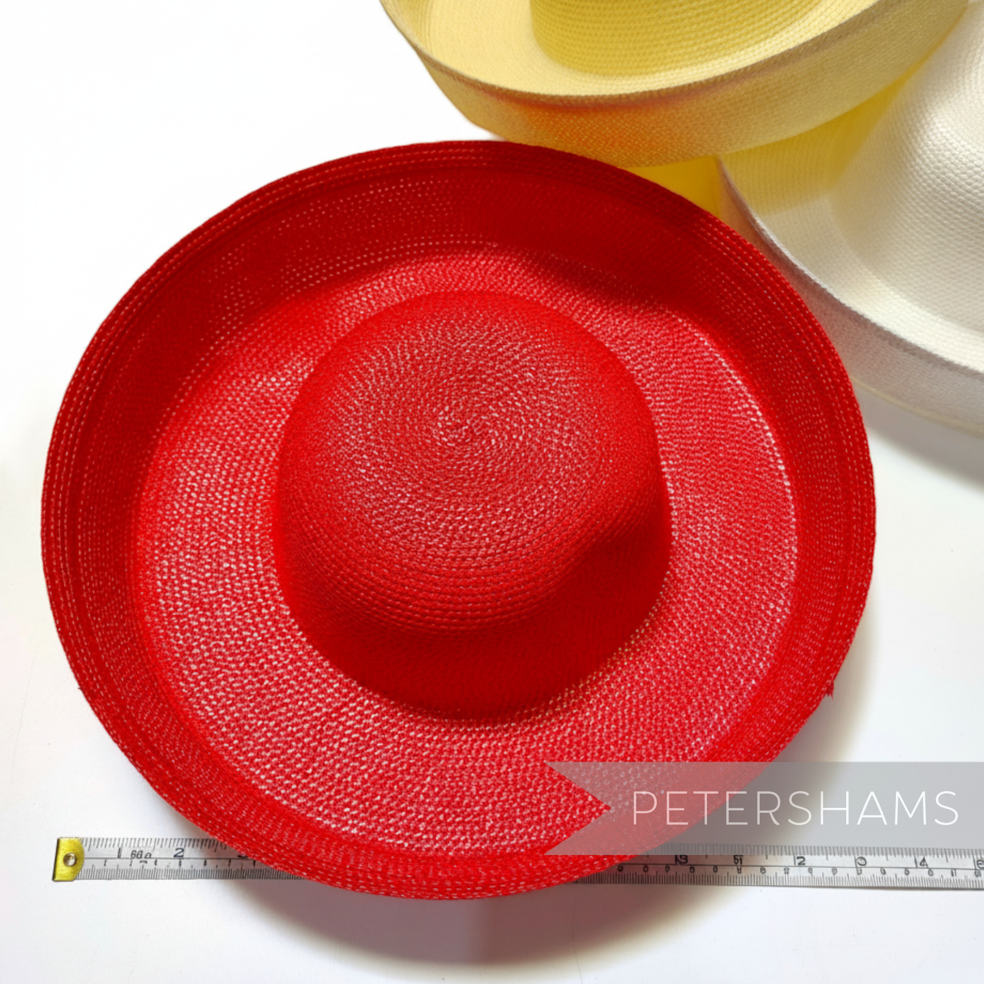 Petershams Millinery Supplies red polybraid sailor hat form with large upturned brim, ideal for occasion hats.