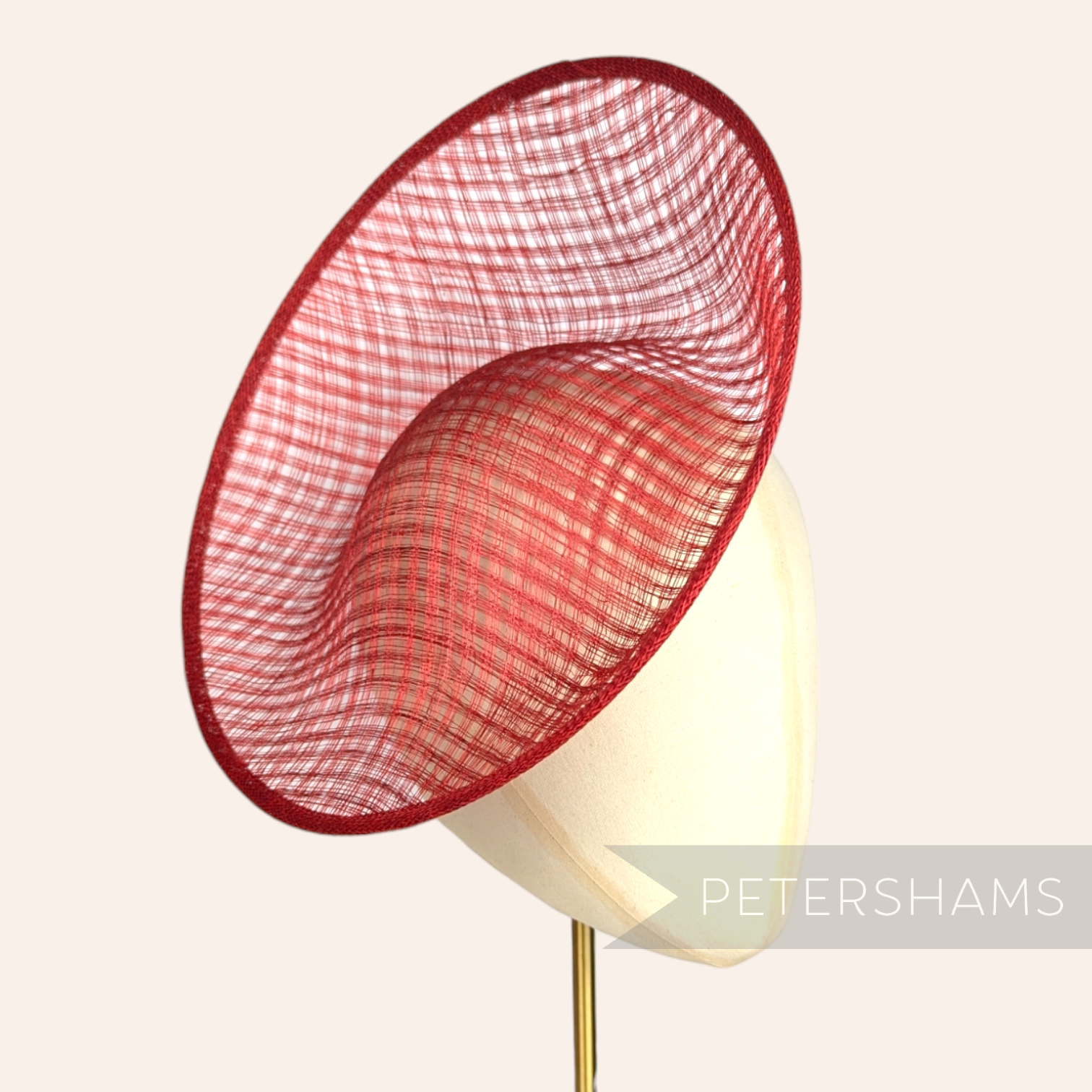 Petershams Millinery Supplies red Amanda lattice weave sinamay fascinator hat base on a millinery head block.