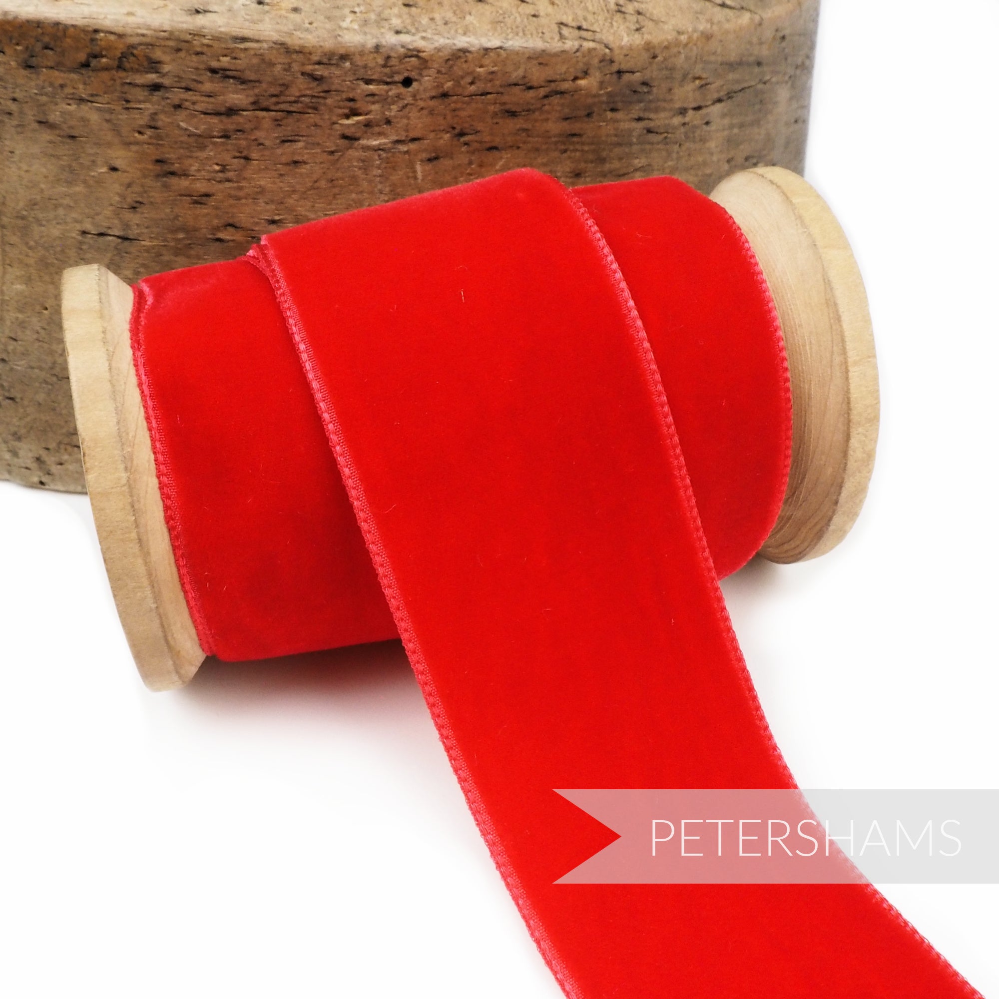 Petershams Millinery Supplies 36mm red French velvet ribbon on a wooden spool for craft and millinery projects.