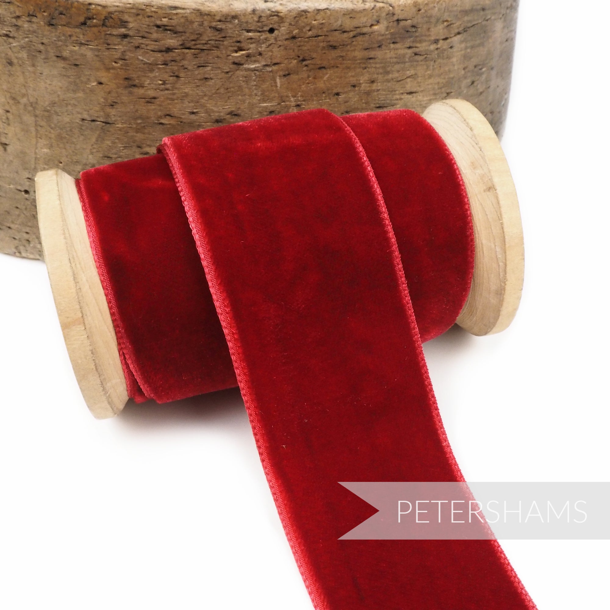Petershams Millinery Supplies 36mm deep red French velvet ribbon on a wooden spool with a luxurious pile and sheen.