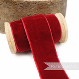 Petershams Millinery Supplies 36mm deep red French velvet ribbon on a wooden spool with a luxurious pile and sheen.