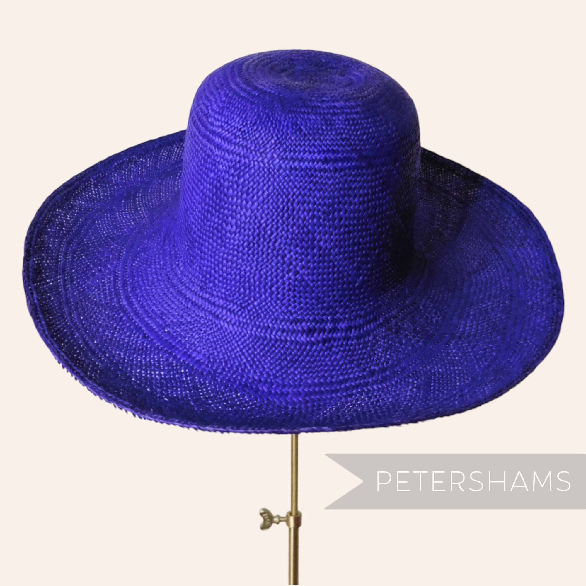 Petershams Millinery Supplies royal purple handmade Panama straw capeline hat body with a fine circular weave.