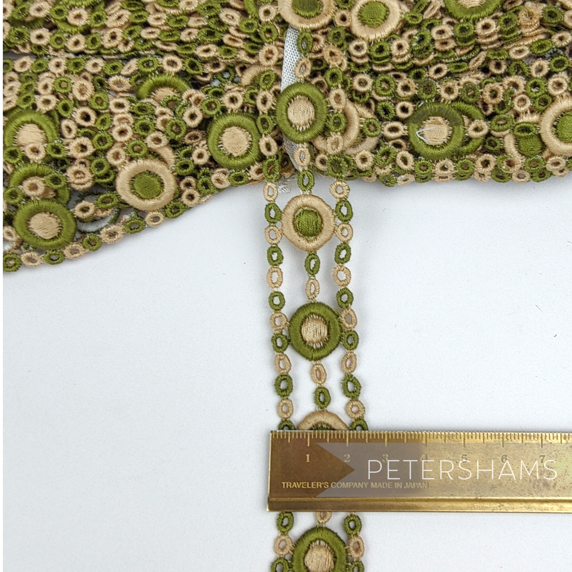 Petershams Millinery Supplies vintage 1950s sage green and beige guipure lace trim with circular pattern