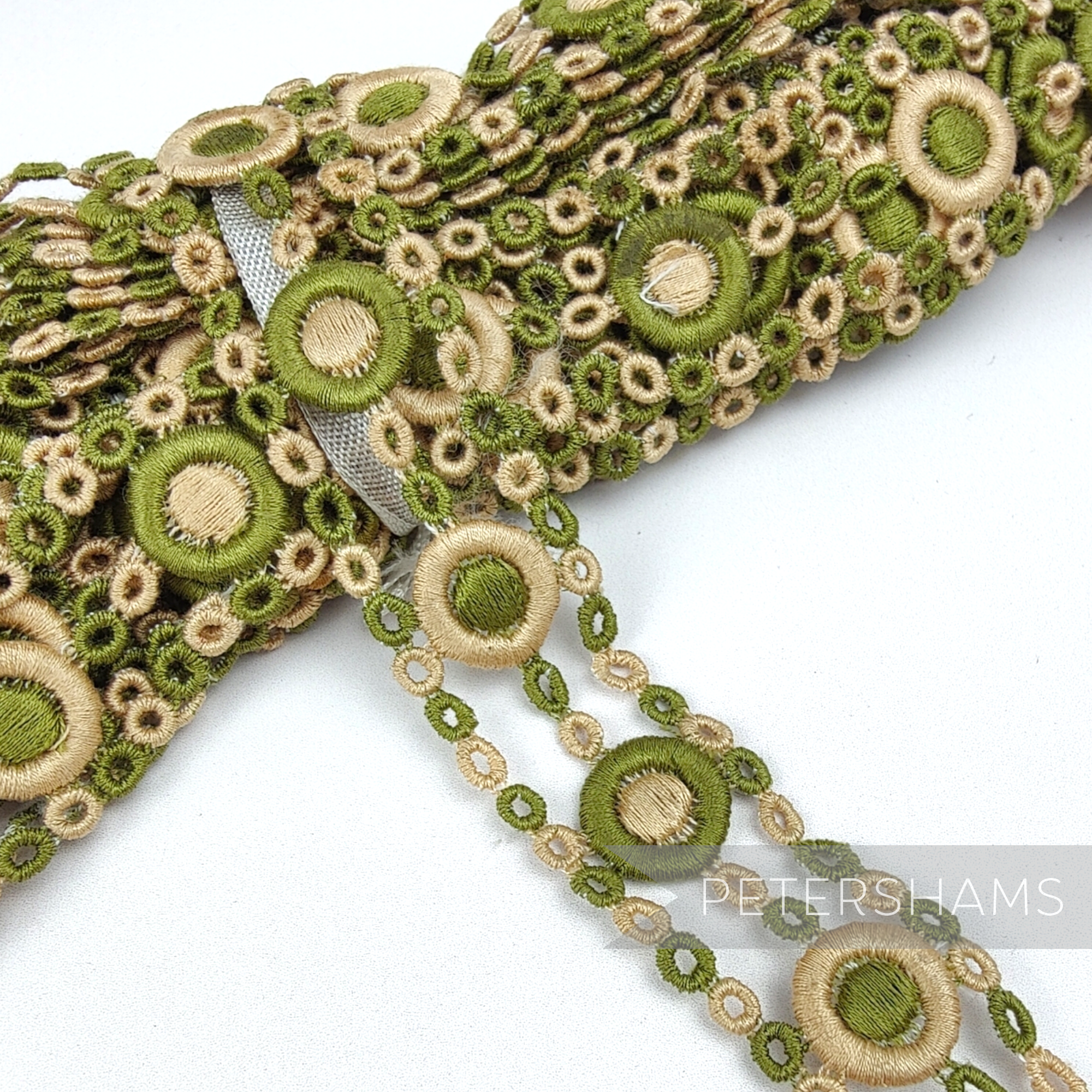 Petershams Millinery Supplies vintage 1950s sage green and beige guipure lace trim with a circular 3D pattern