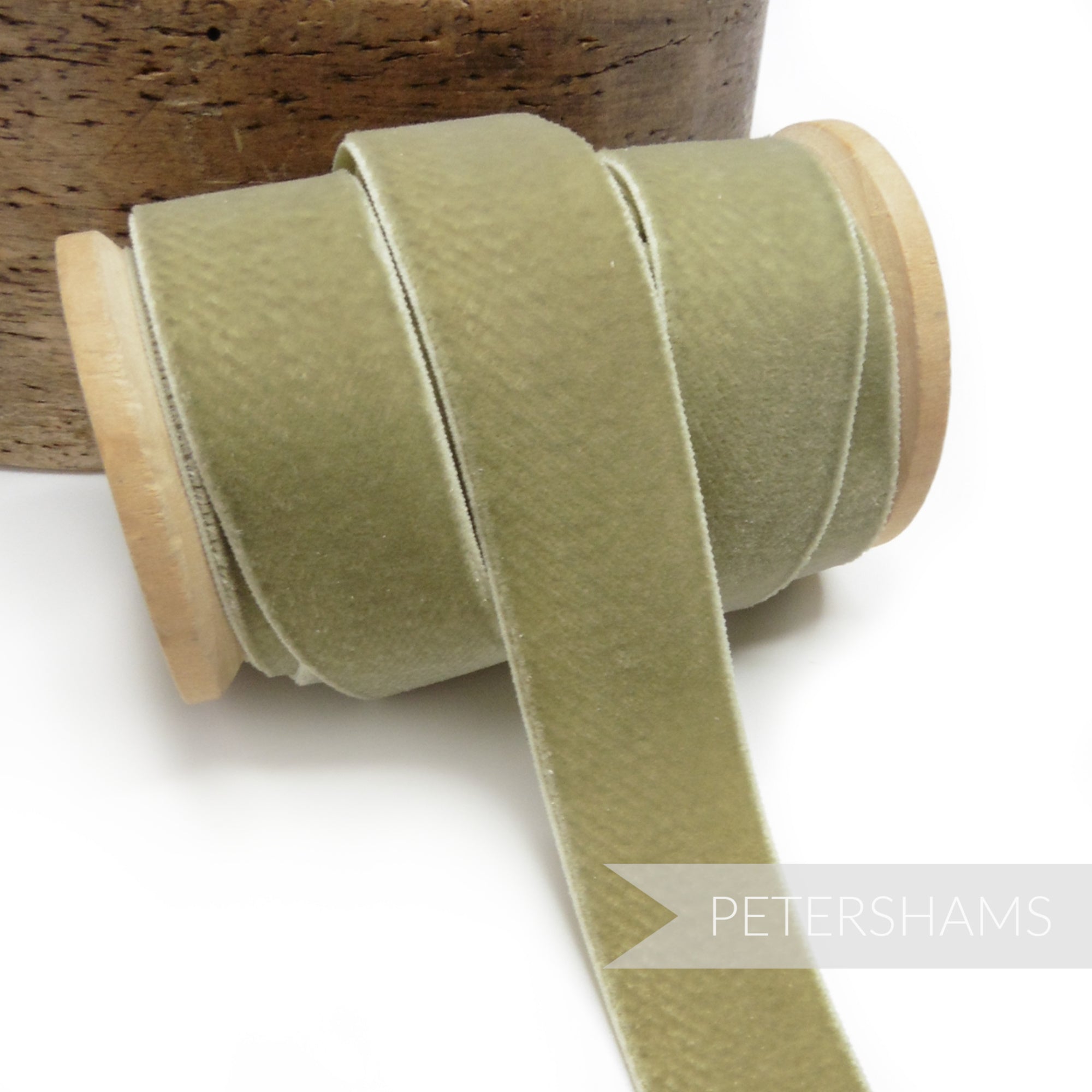 Petershams Millinery Supplies 23mm sage green elastic stretch velvet ribbon on a wooden spool for millinery projects